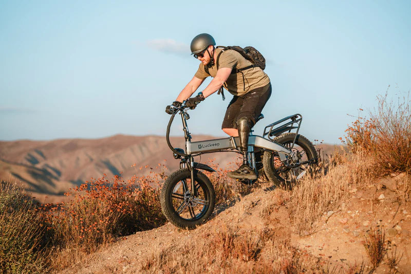 The X1 E-Bike by Luckeep  - Folding - 30 MPH - 20 x 4 Fat Tire Mountain or City E-Bike - Features front suspension, hydraulic disc brakes and turn signals for easier storage.