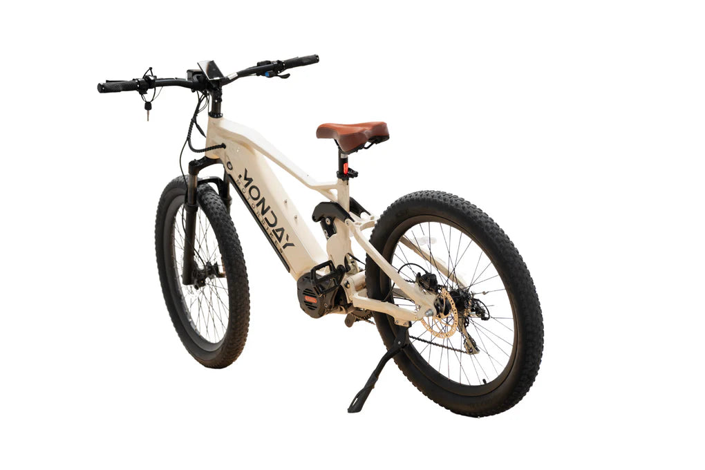 Beige bicycle with 'Monday' branding on a white background